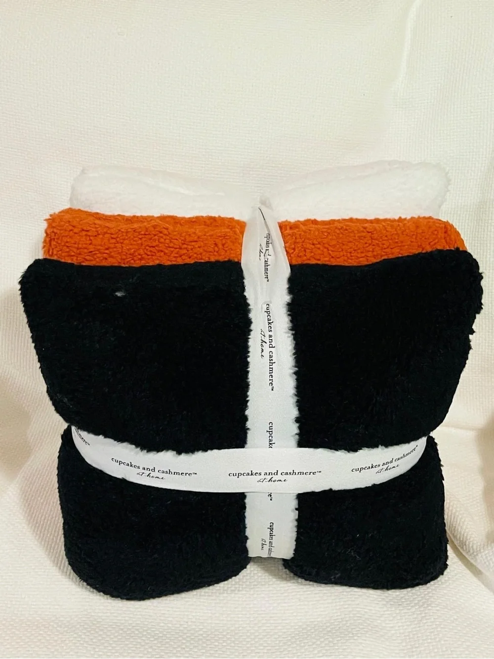 cupcakes & cashmere White Plush Throw with Black & Brown Accents